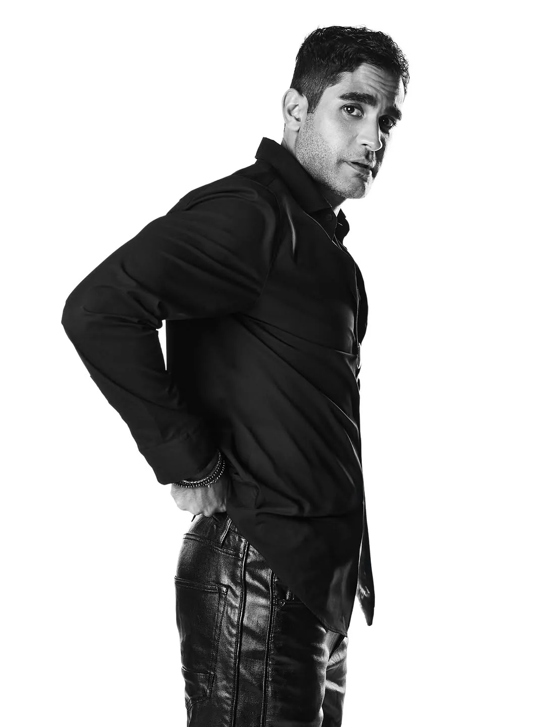 Black shirt and leather trousers, high-key studio